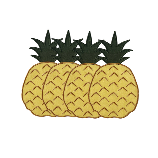 A set of four cocktail napkins with a pineapple design, featuring a green and yellow color scheme on a white background.