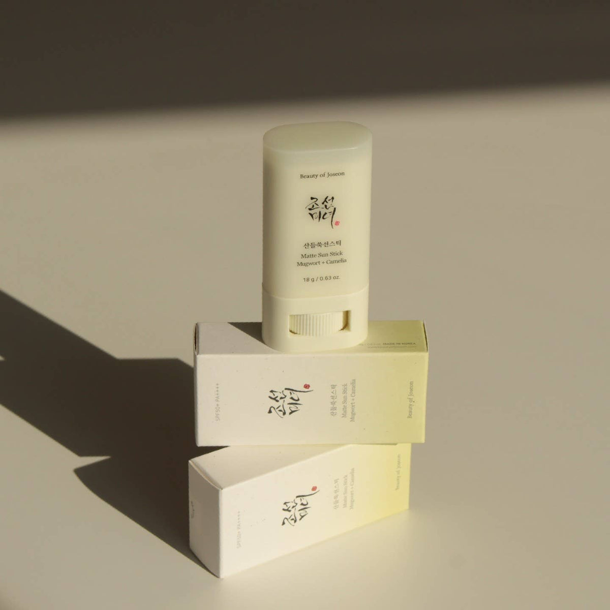 Beauty of Joseon Matt Sun Stick with matching boxes, white sunscreen tube