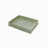 Large scalloped serving tray with striped green and white fabric sides and base.