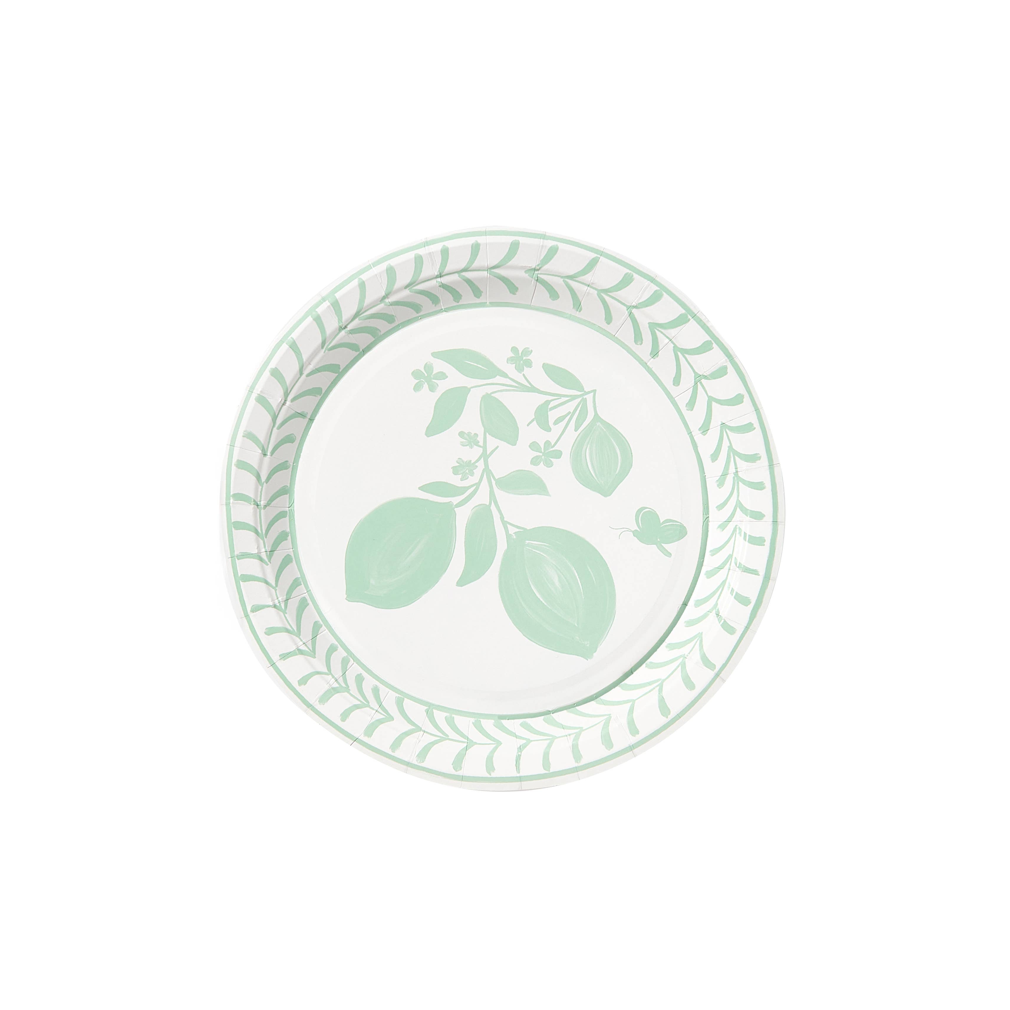 Round paper plate with green botanical leaf border and central leaf design