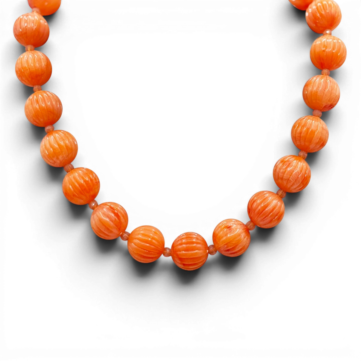 Coral orange carved resin bead necklace with round melon-style beads