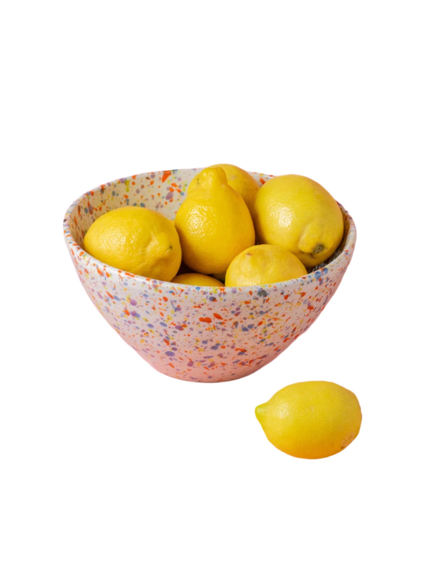 Ceramic salad bowl with multicolor speckles filled with yellow lemons