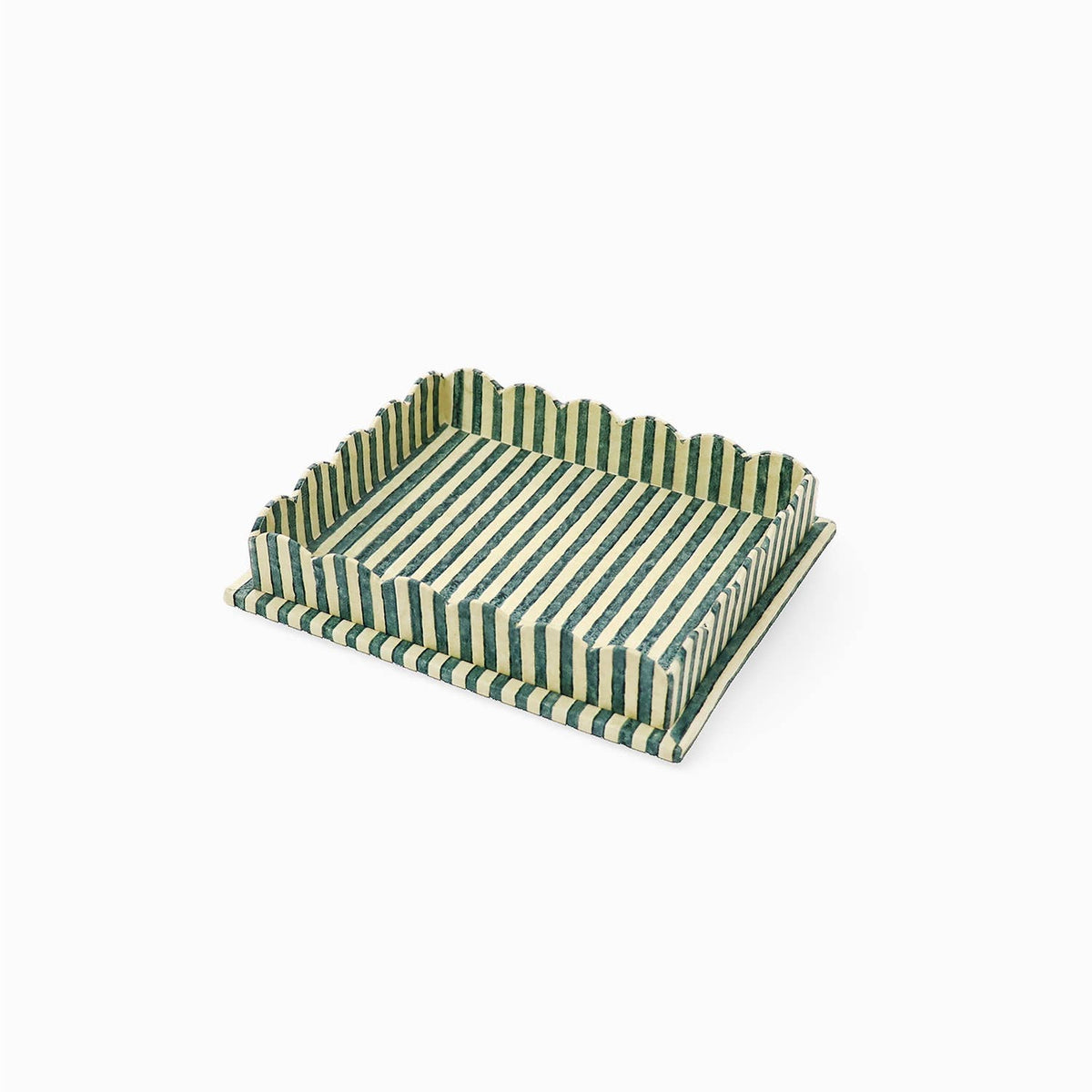 Large scalloped serving tray with striped green and white pattern from above.