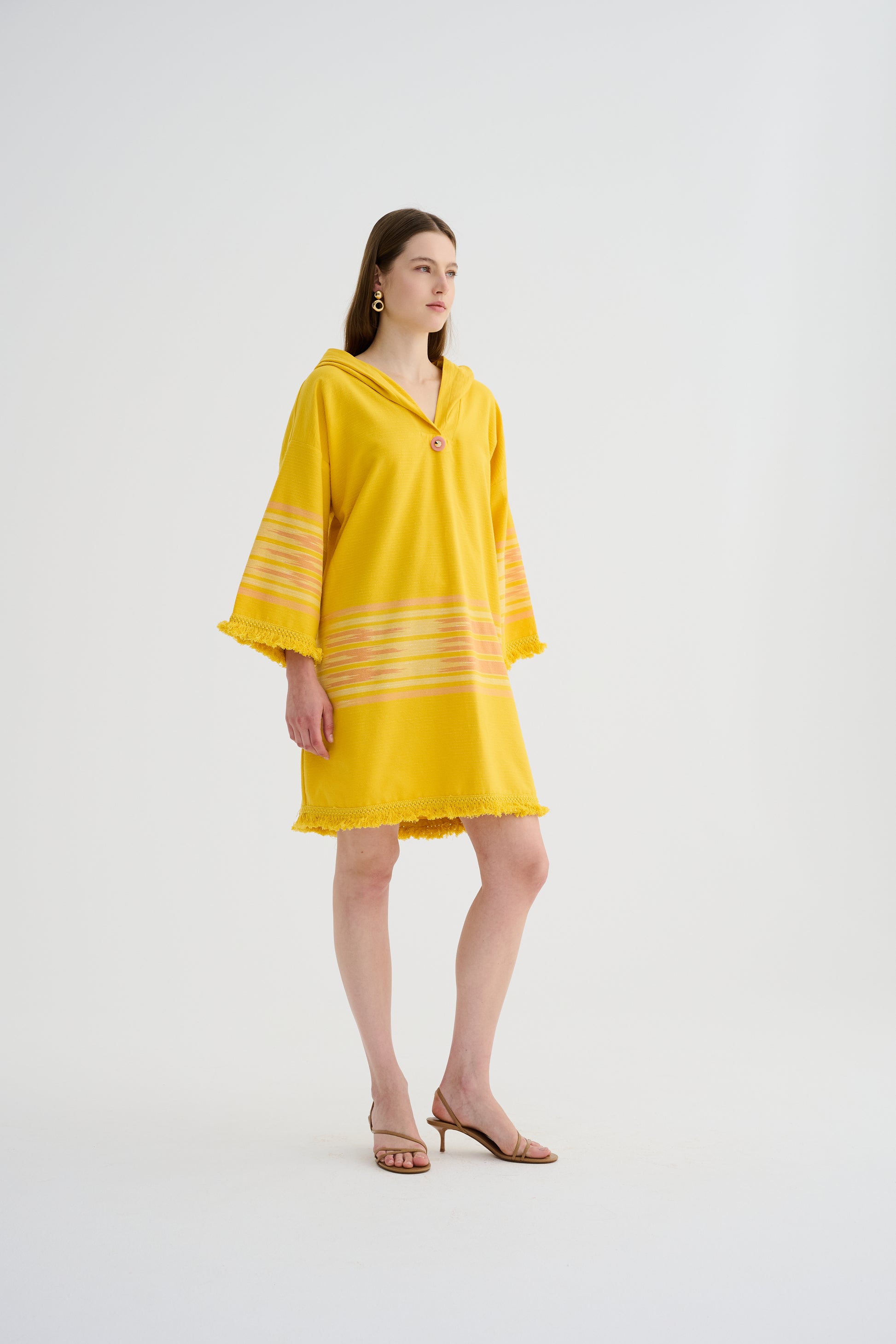 Yellow hooded mini dress with horizontal striped sleeve panels and fringed edges