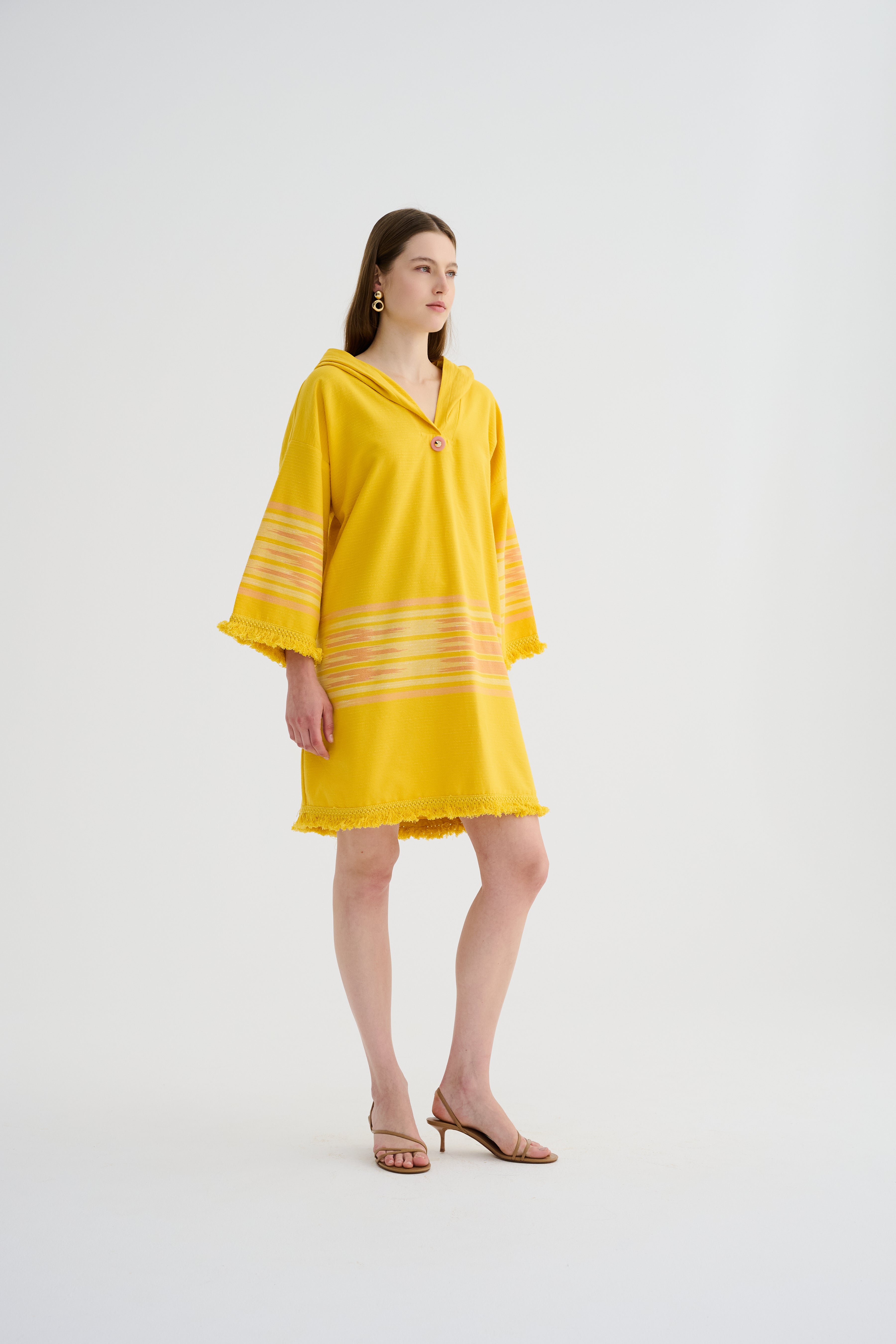 Yellow hooded mini dress with horizontal striped sleeve panels and fringed edges