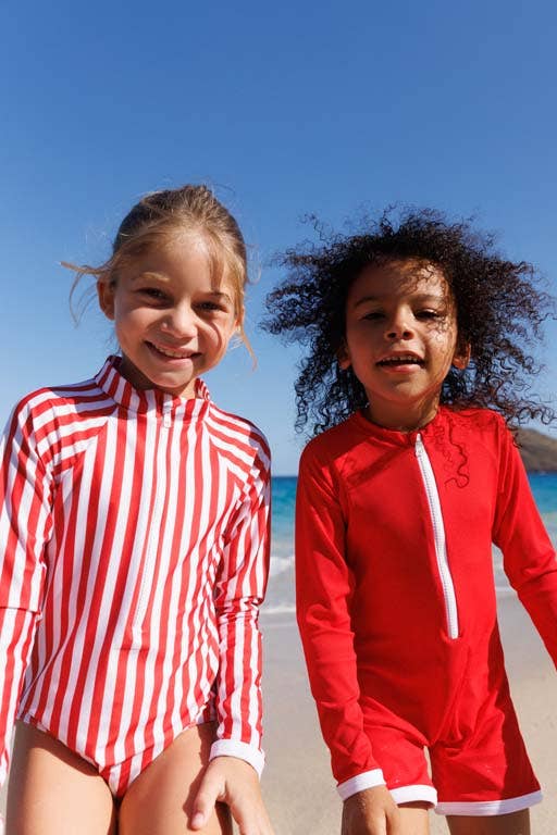 Girls' red rash guard with long sleeves and white front half-zip