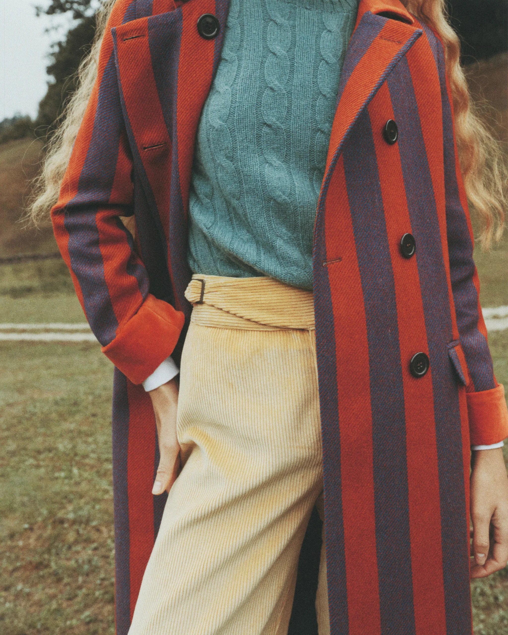 Light yellow corduroy pants on model, high-rise waistband and straight cropped legs
