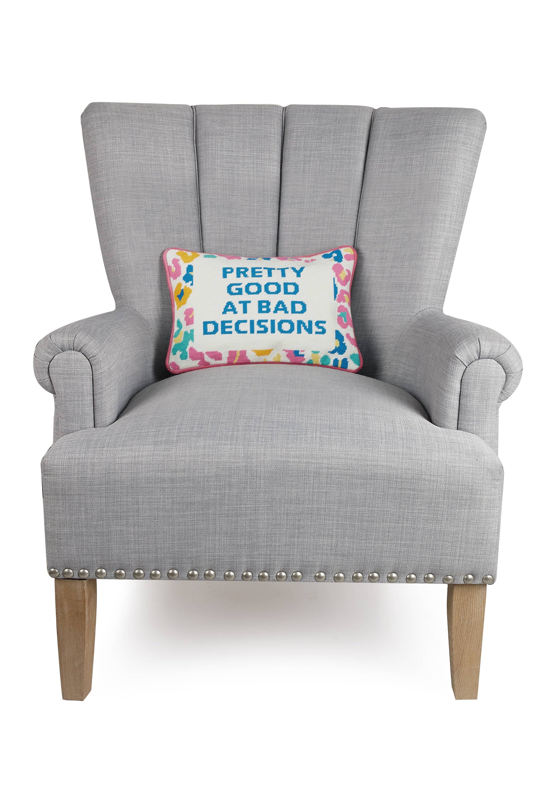 Decorative throw pillow with embroidered blue text on multicolor border