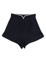 Navy linen shorts with white-trim waistband and pleated front