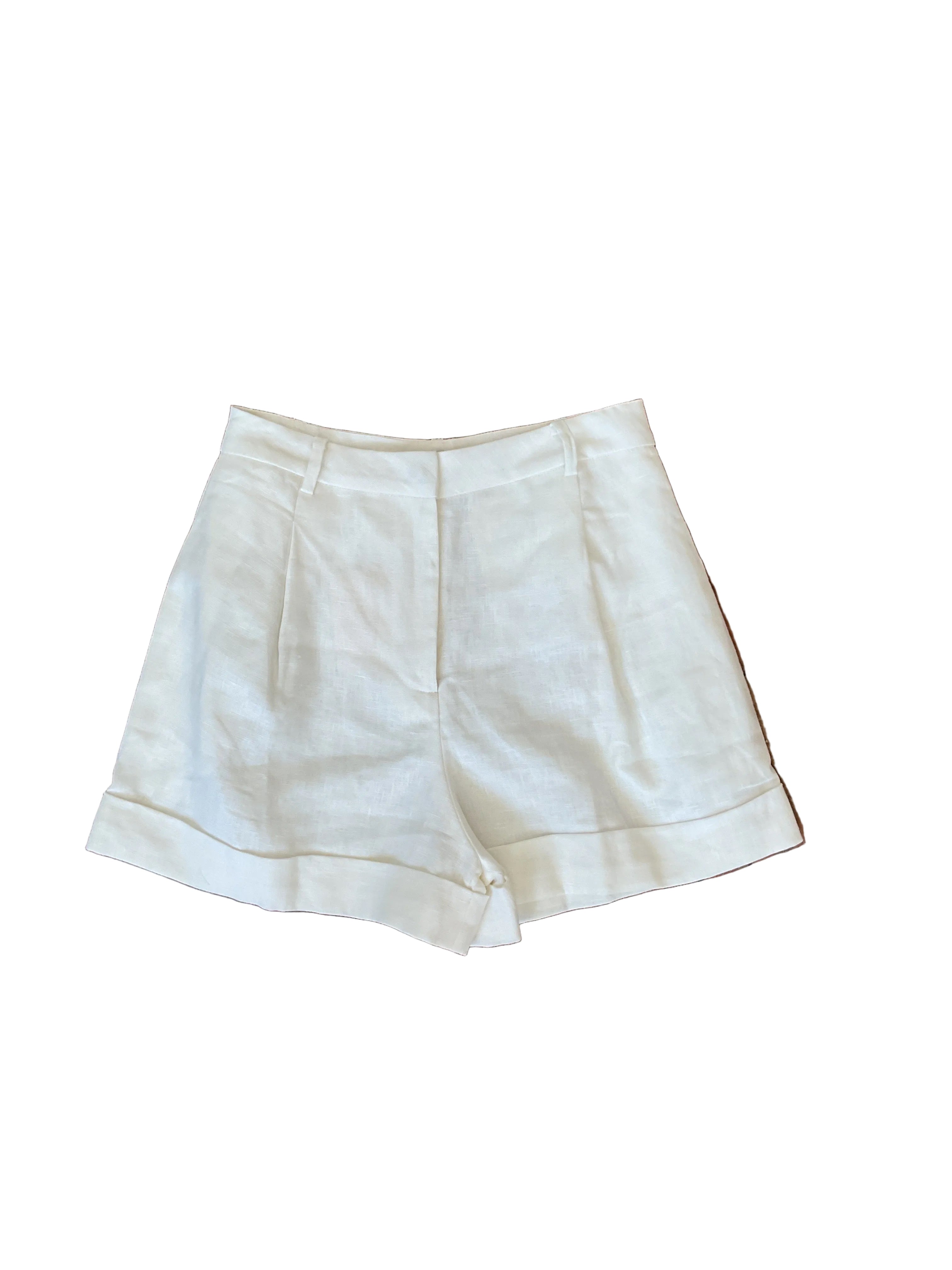 White linen cuffed short with front pleats, waistband, and folded cuff hem