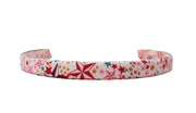 Star-pattern headband in red, white, green, and gold