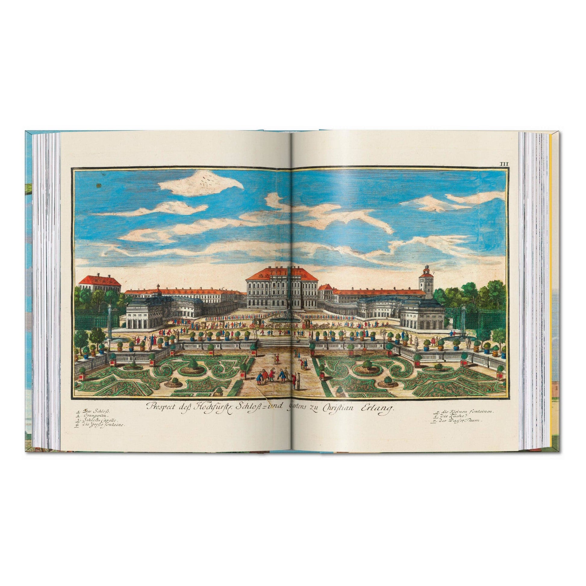 Open illustrated citrus fruit book showing a large estate landscape plate
