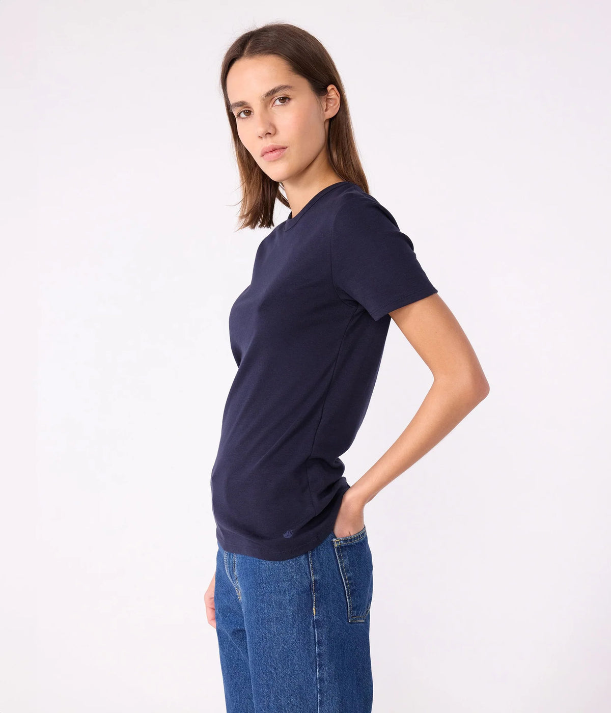 Women's navy crew-neck T-shirt on model, short sleeves