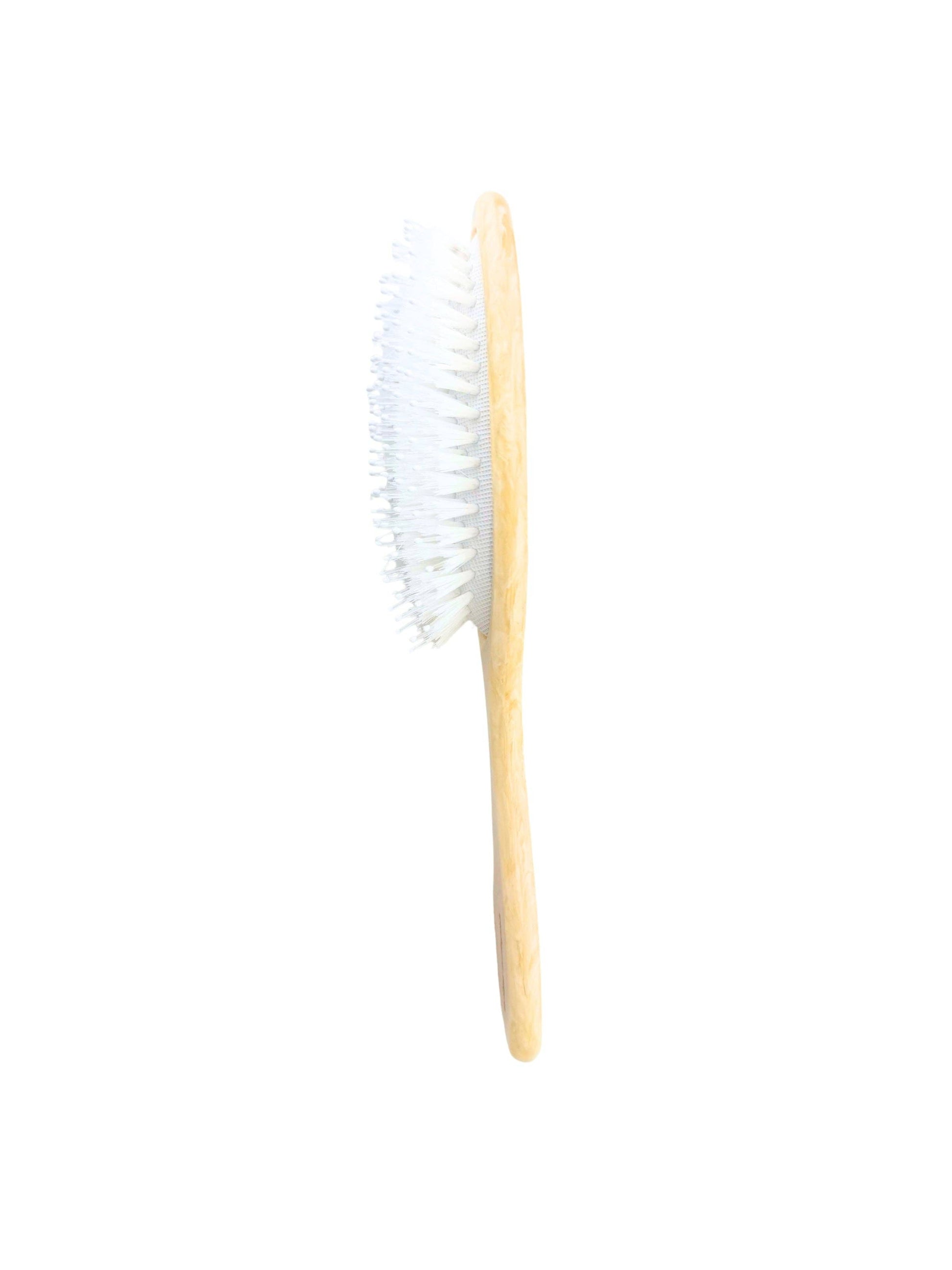 Wood-handled hairbrush with white bristles and side profile