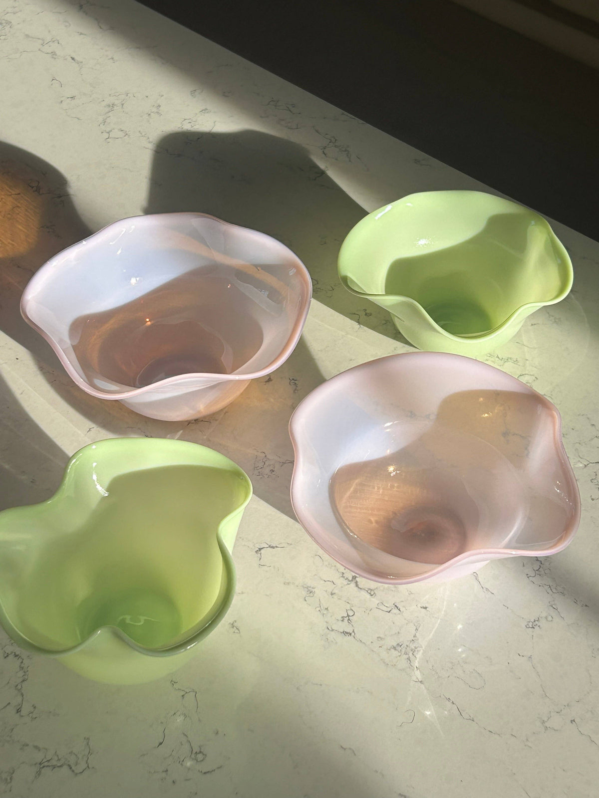 Glossy green ruffle bowl with fluted, scalloped rim.