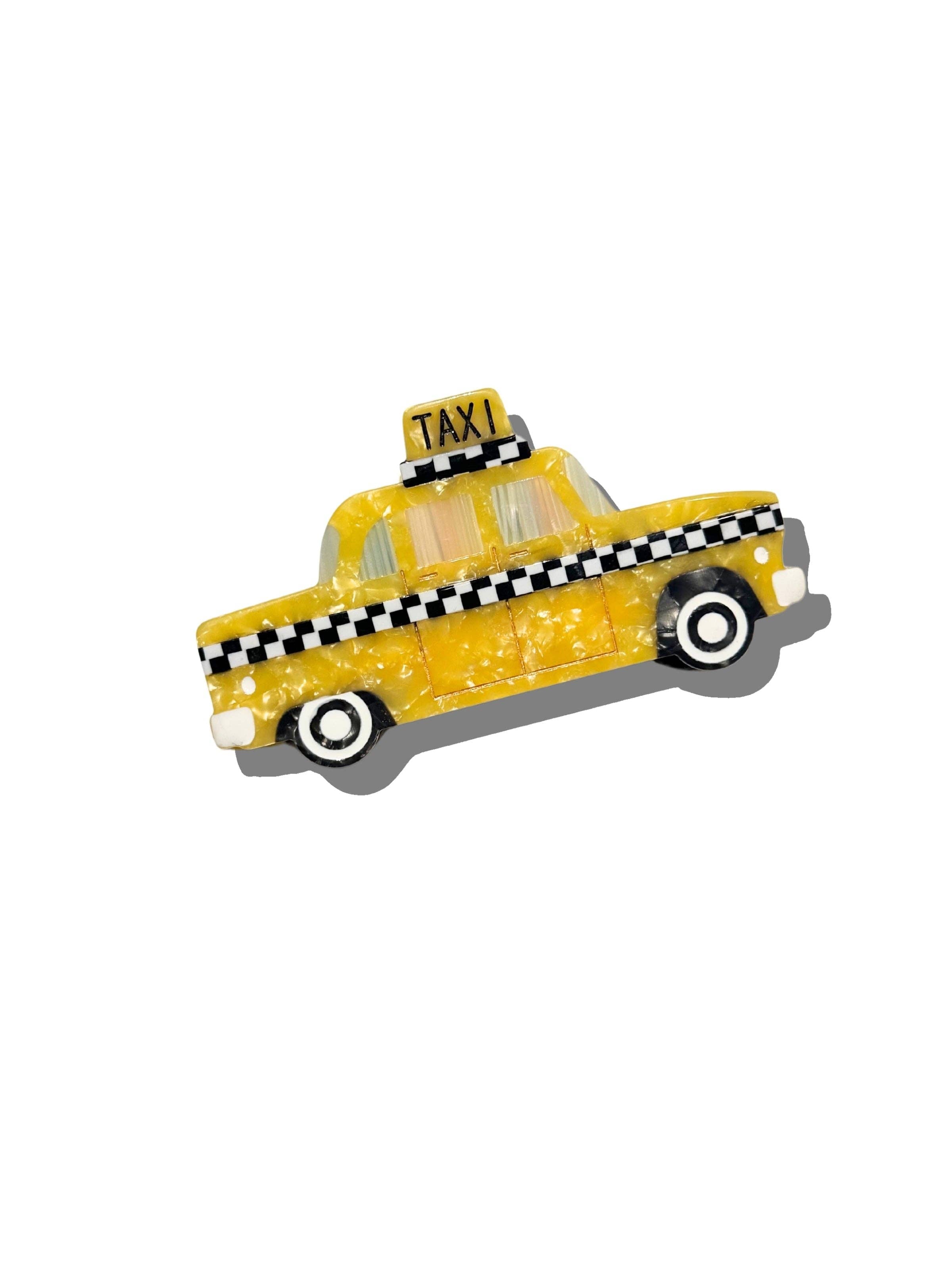 Yellow taxi cab claw hair clip with checkered stripe and TAXI rooftop sign