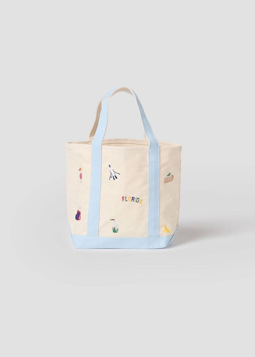 Small canvas tote bag with light blue trim, front Florida icon panel, open handles