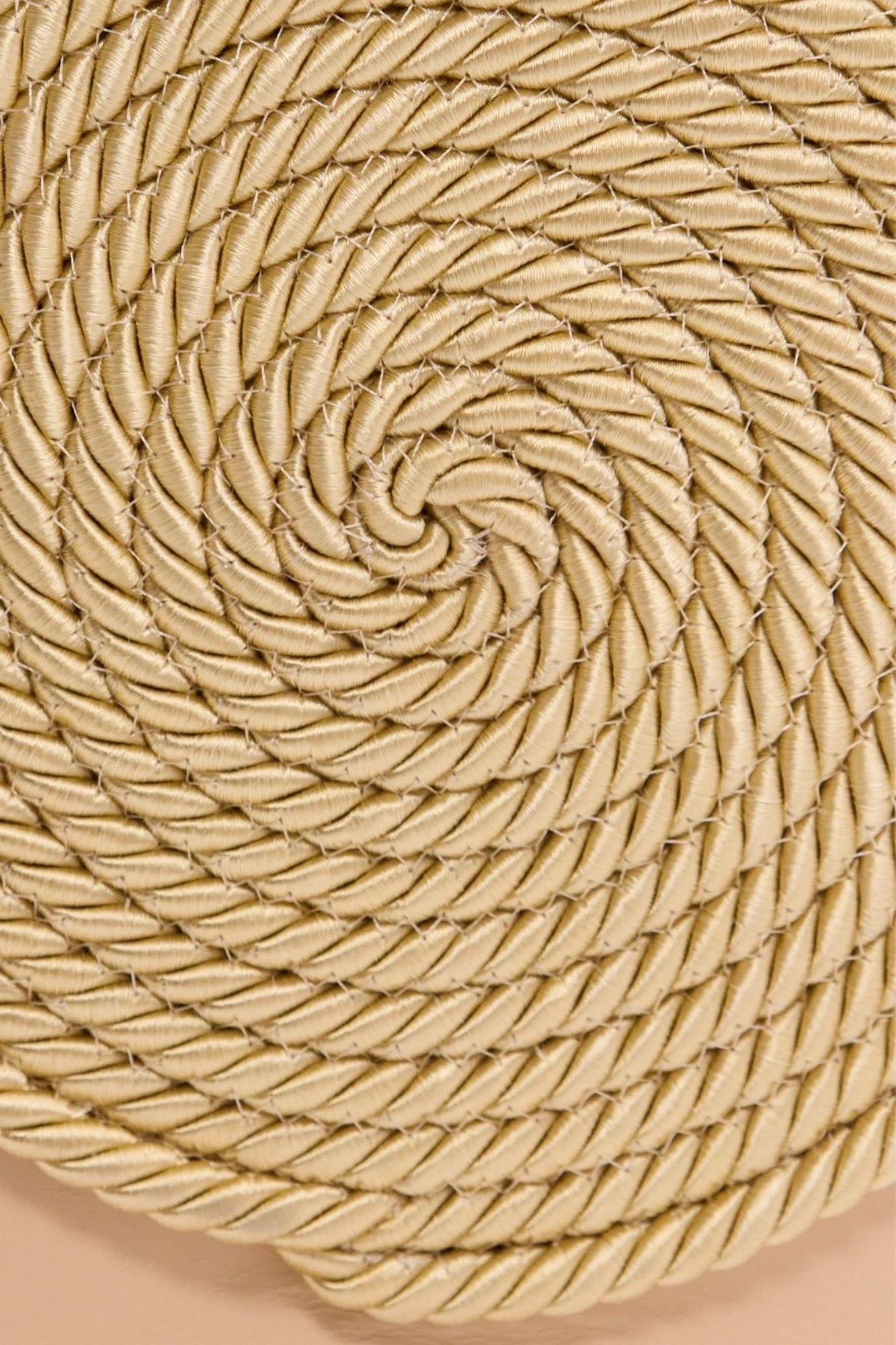 Close-up of beige spiral woven texture on the bag