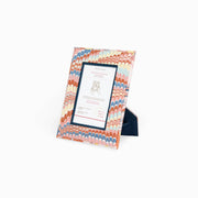 Hand marbled tabletop picture frame with white label card in black border