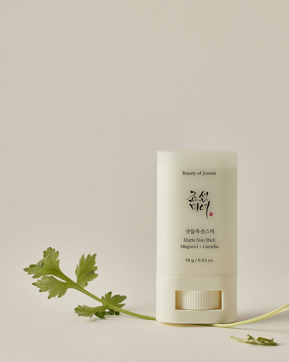 Beauty of Joseon Matt Sun Stick standing upright, white matte sunscreen tube