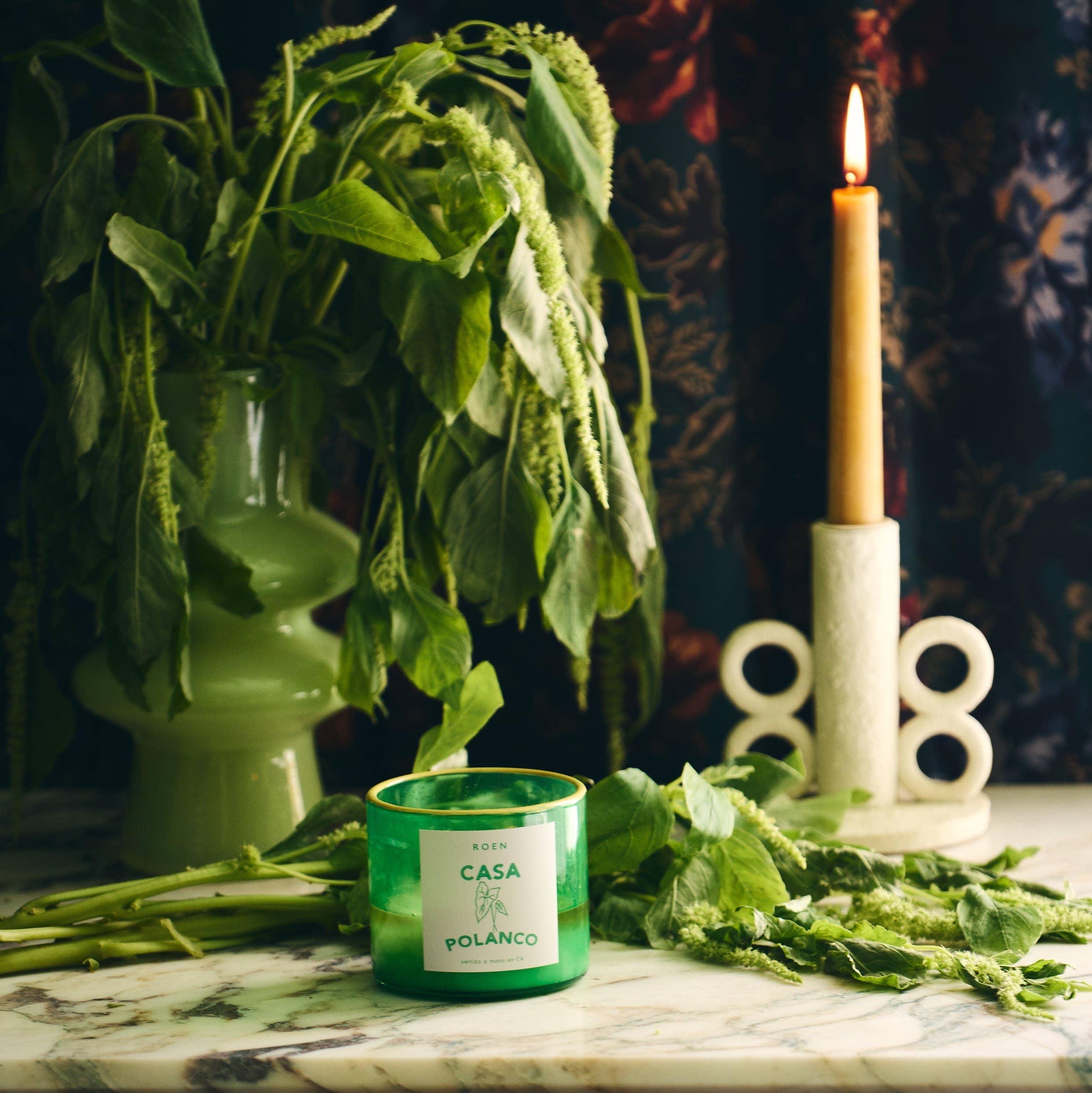 Green scented candle jar with CASA POLANCO label