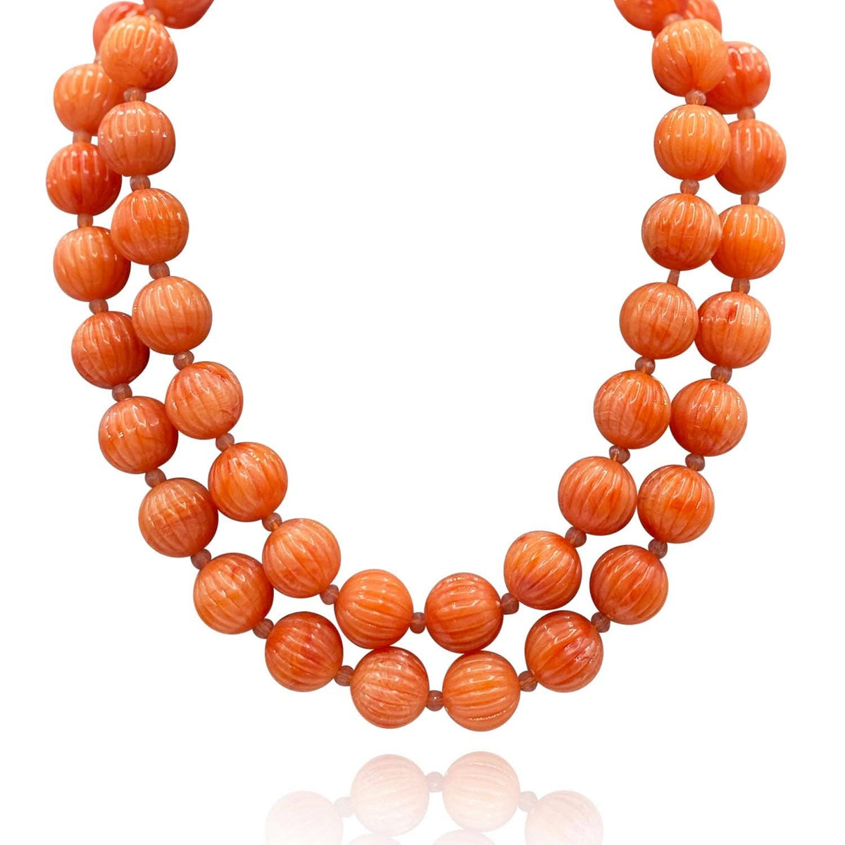 Coral orange carved resin bead necklace featuring round melon-style beads