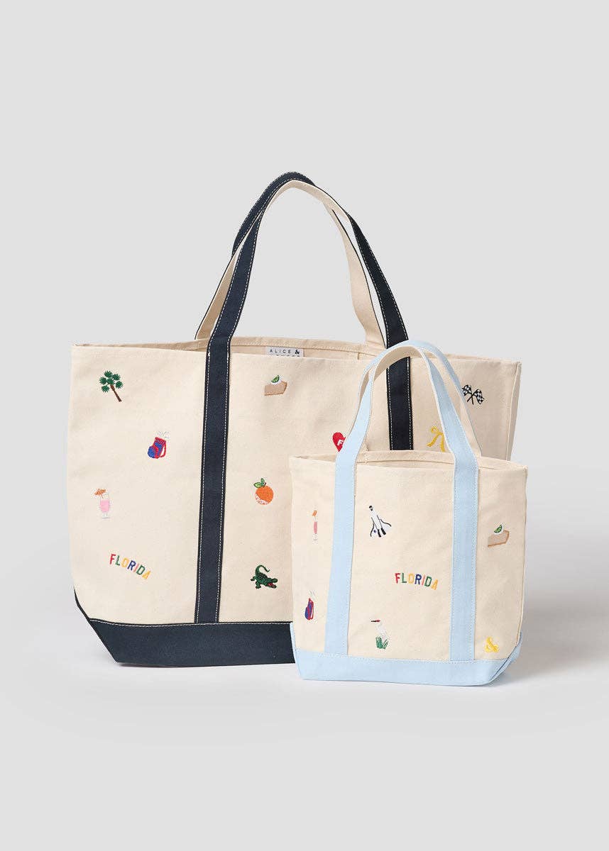 Set of canvas tote bags: beige with navy handles and a smaller light-blue tote