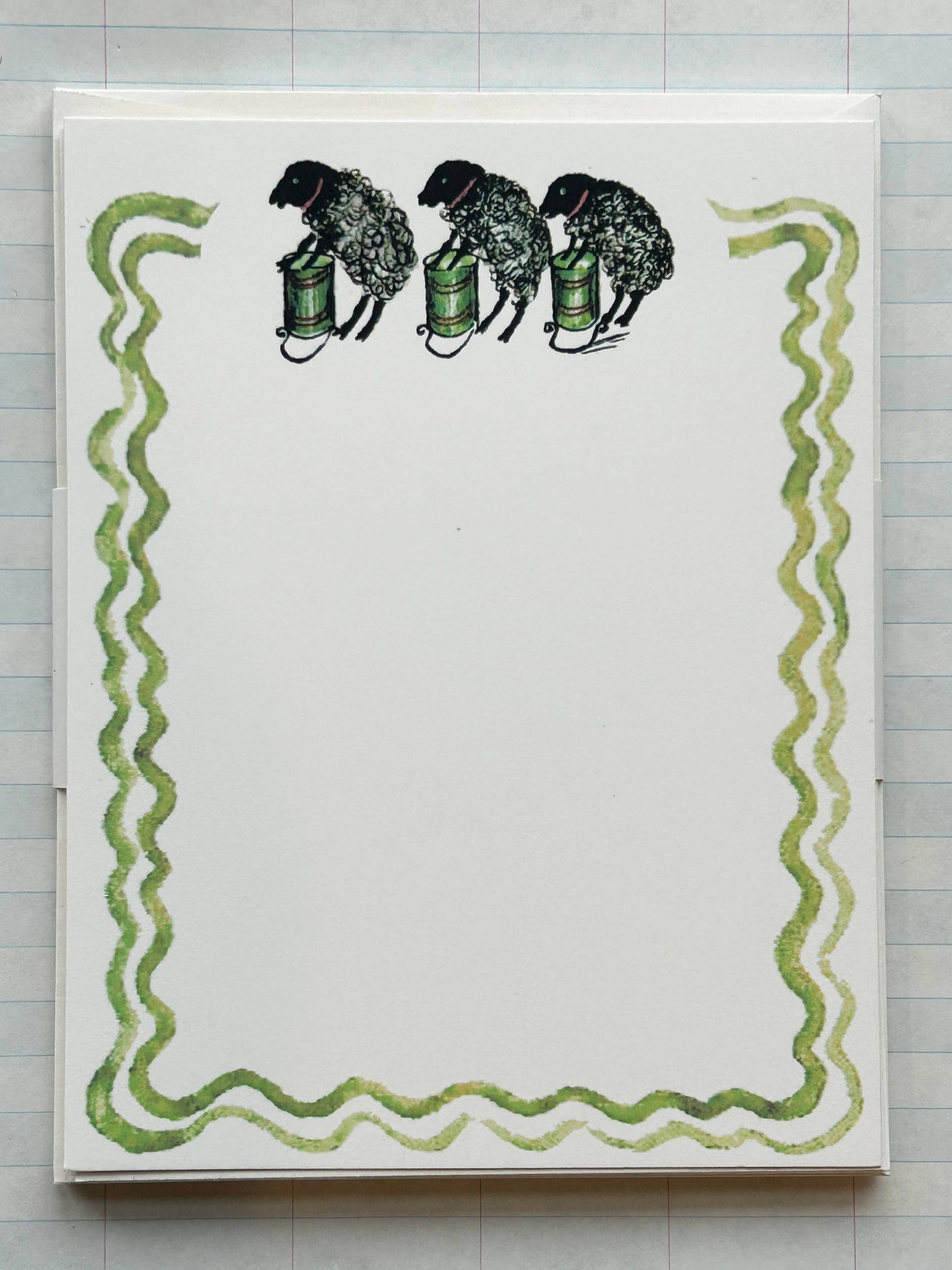 Animal Jamboree stationery card with three black sheep and green wavy border