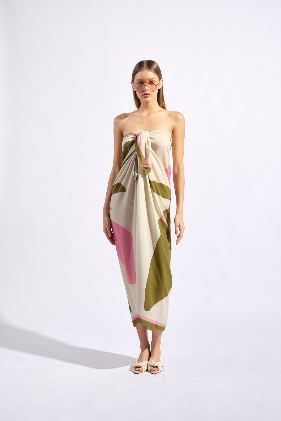 Balearic panneau sarong worn as strapless wrap, cream base with pink and olive print