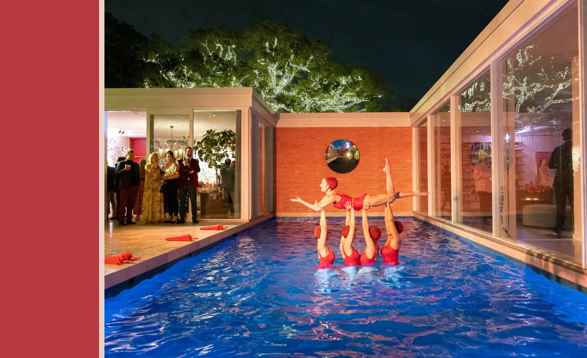 Open book spread with a swimming-pool party photo at night with people in the water