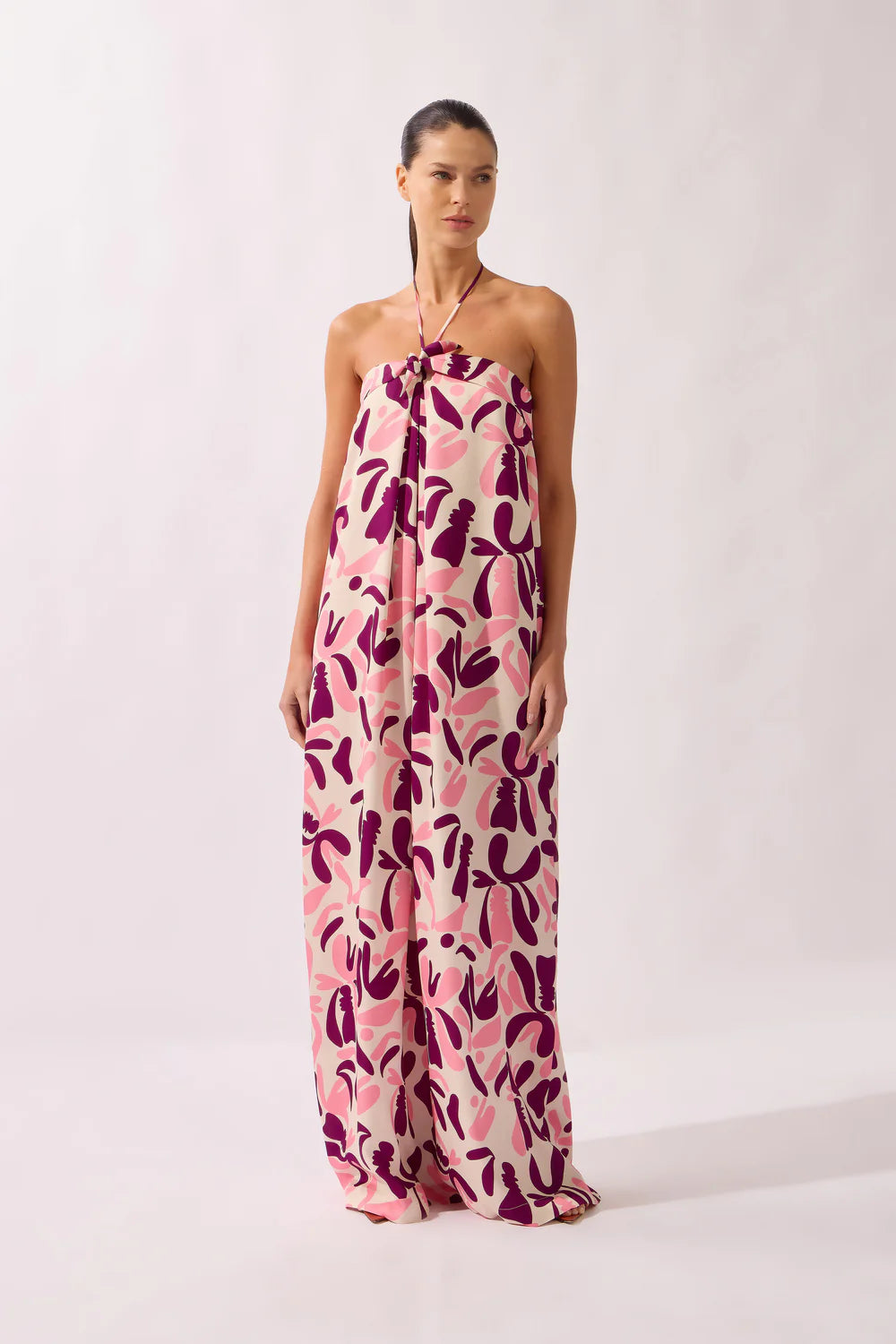 Halterneck maxi dress, sleeveless silhouette, bold floral print in pink and mauve.
