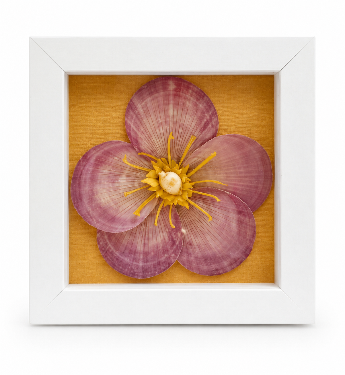 Small framed shell flower wall art with pink-purple petals and yellow center