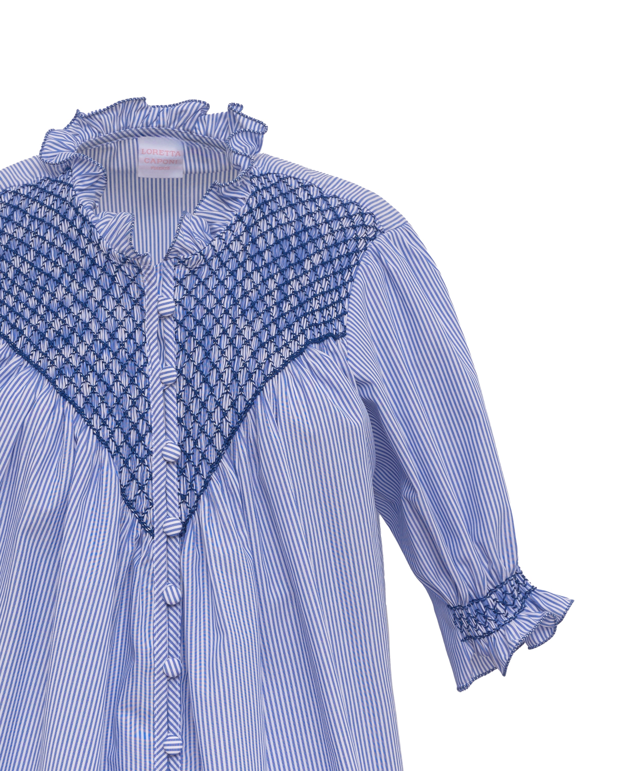 Light blue striped shirt with textured blue yoke trim and ruffled cuff detail