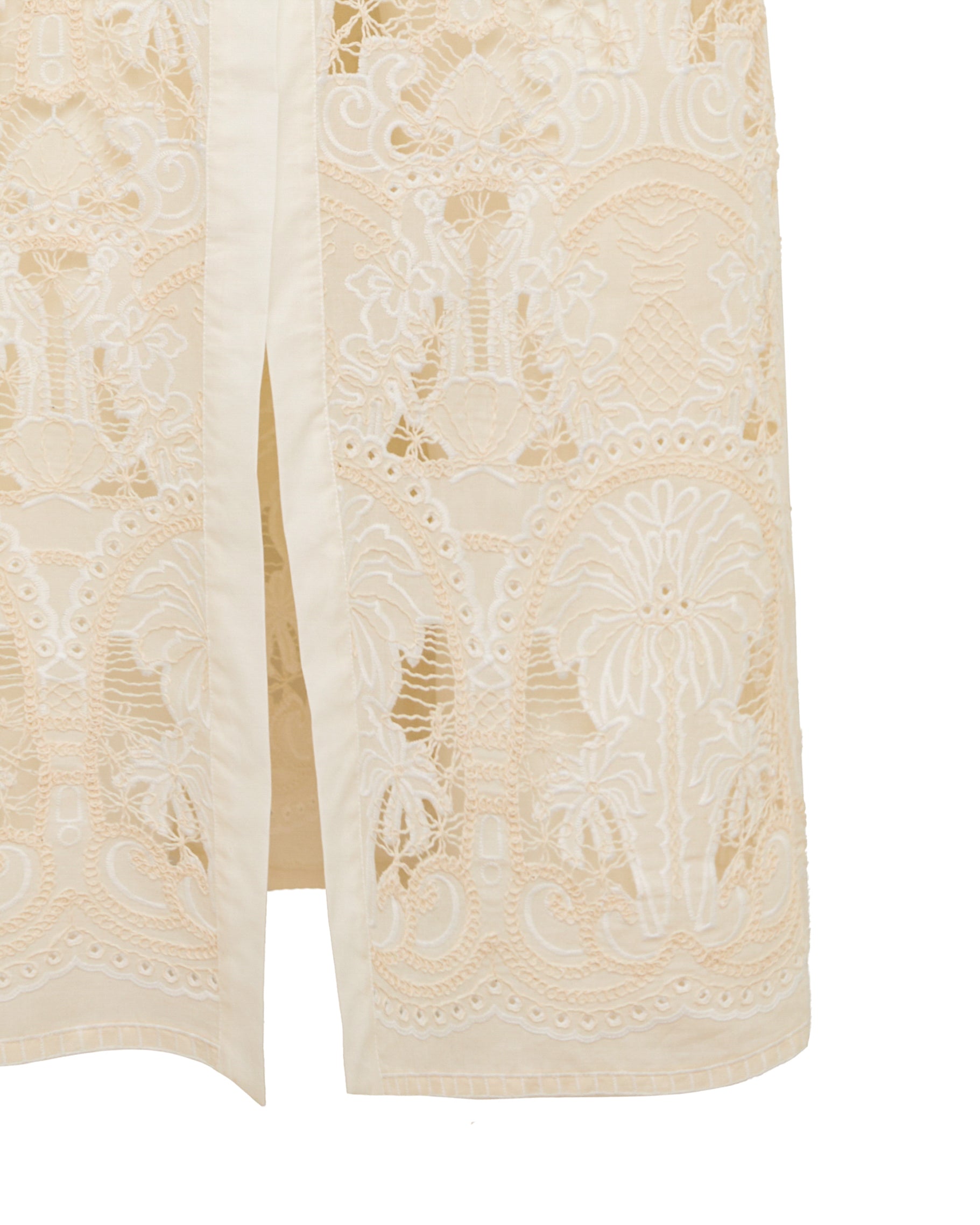 Cream embroidered duster coat detail with open front and side slit hem