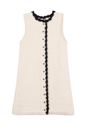 Lalia knit dress in cream with black scalloped trim and button placket