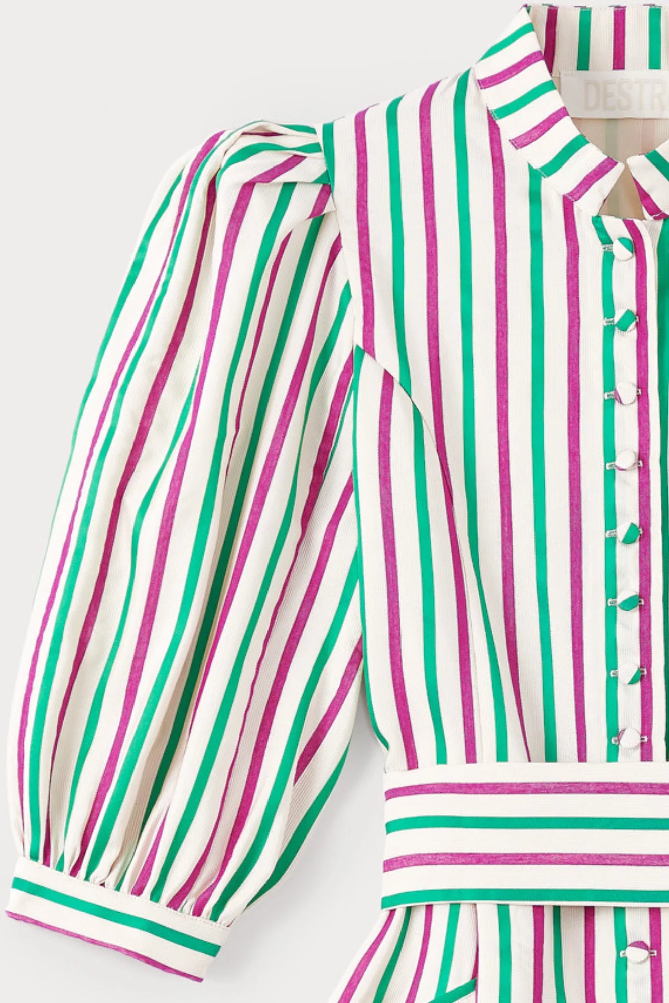 Striped dress bodice detail with puff sleeves, button placket, and striped cuffs