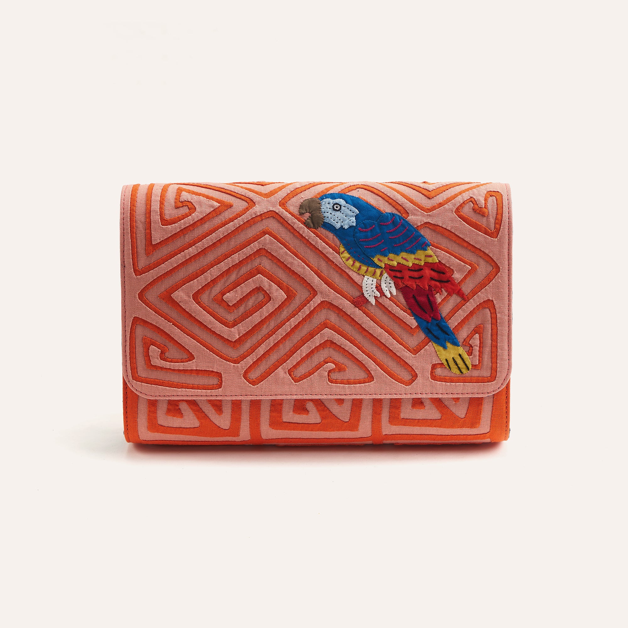 Guacamaya clutch with orange geometric embroidery and colorful parrot on front flap