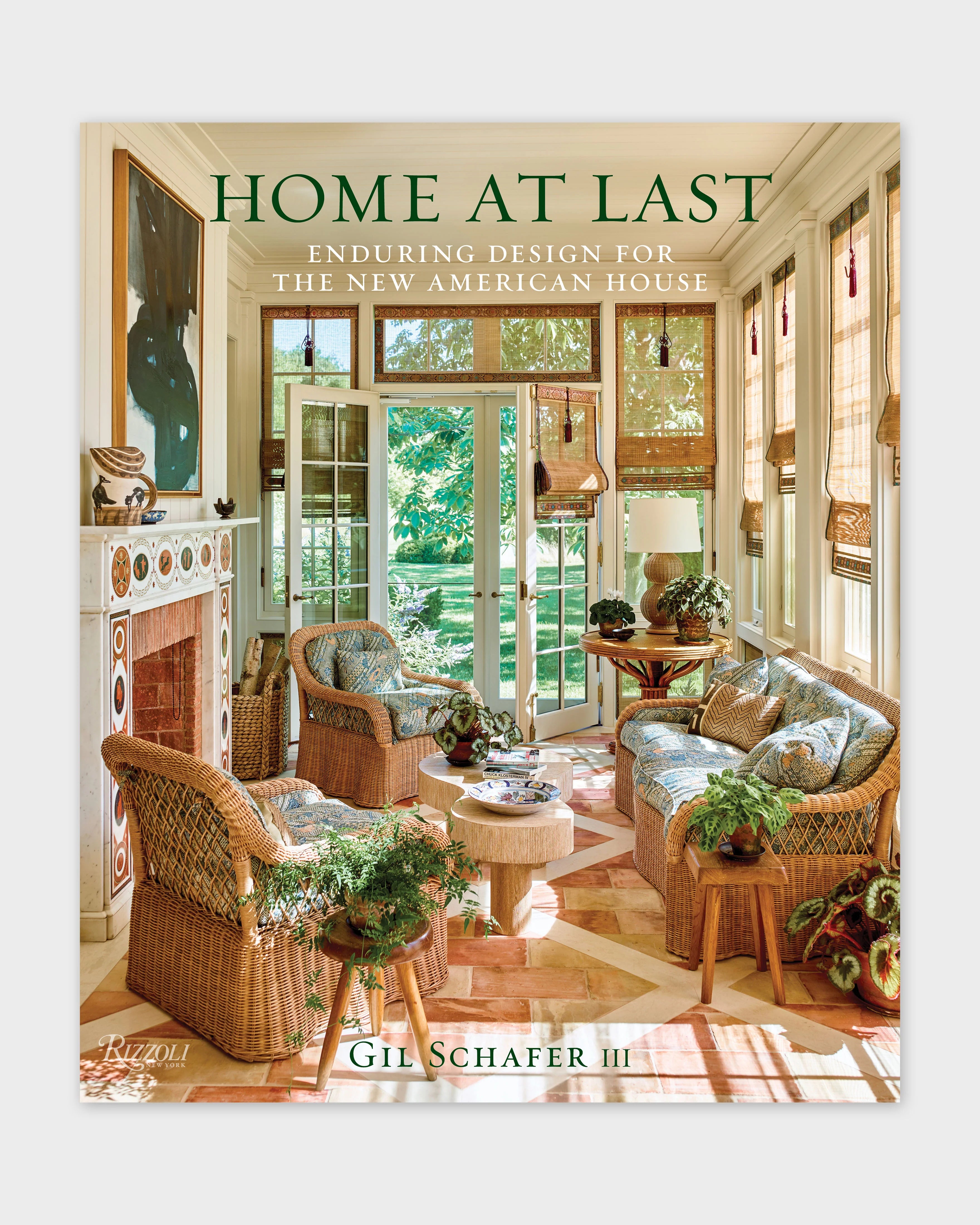 Architecture book cover with HOME AT LAST title text and warm interior photo