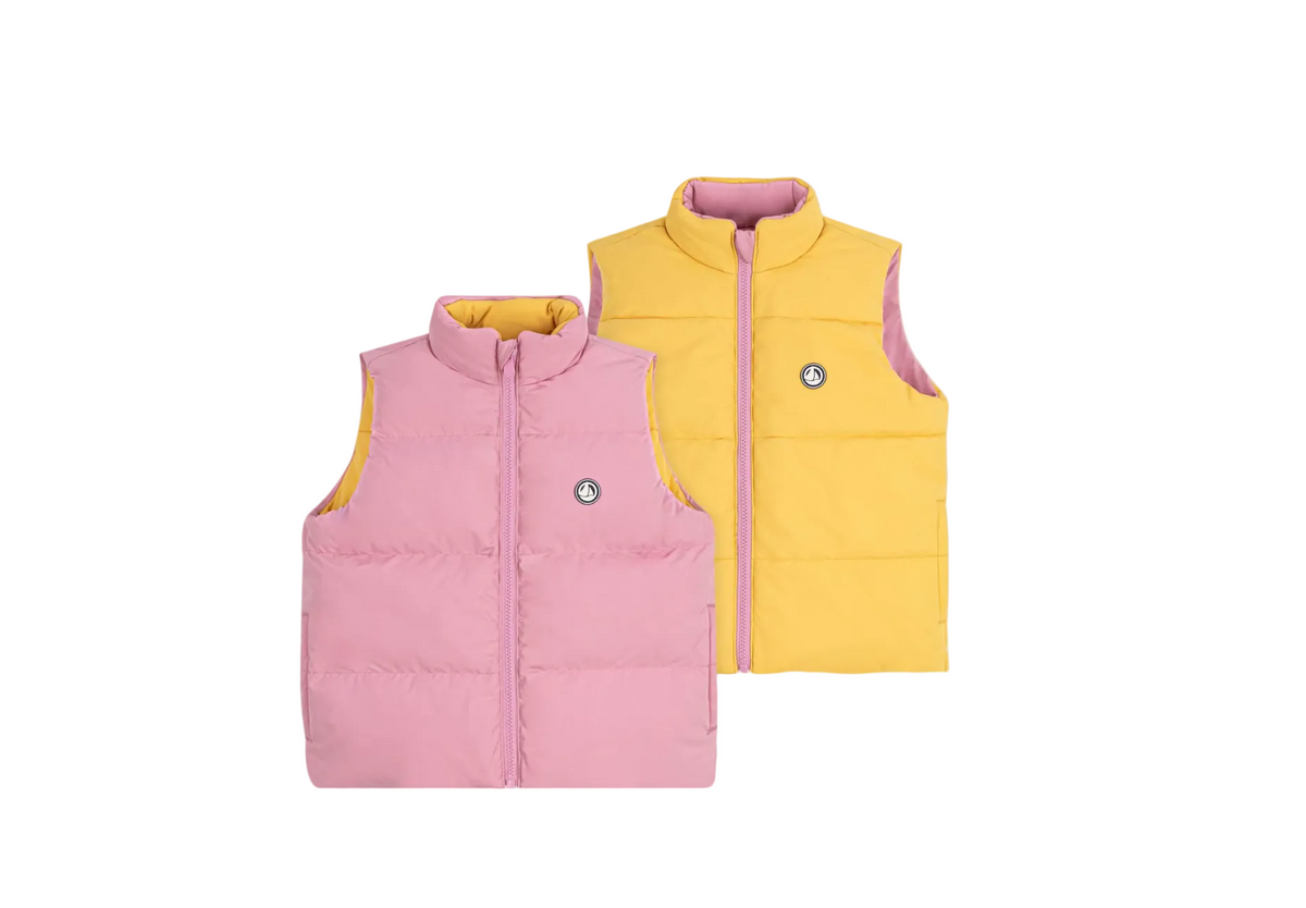 Kids reversible puffer vest in pink and yellow with front zipper