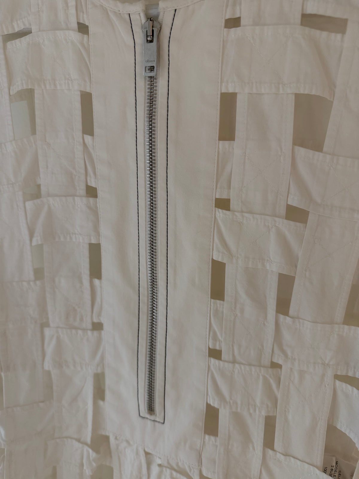 Off-white patchwork sleeveless dress detail: center-front exposed zipper