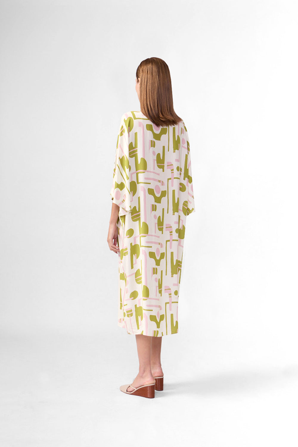 Maxi kaftan back view with abstract yellow-green and pink print, short sleeves