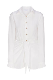 White wrap mini dress with button front, V-neck, long sleeves, gold buttons, tied waist