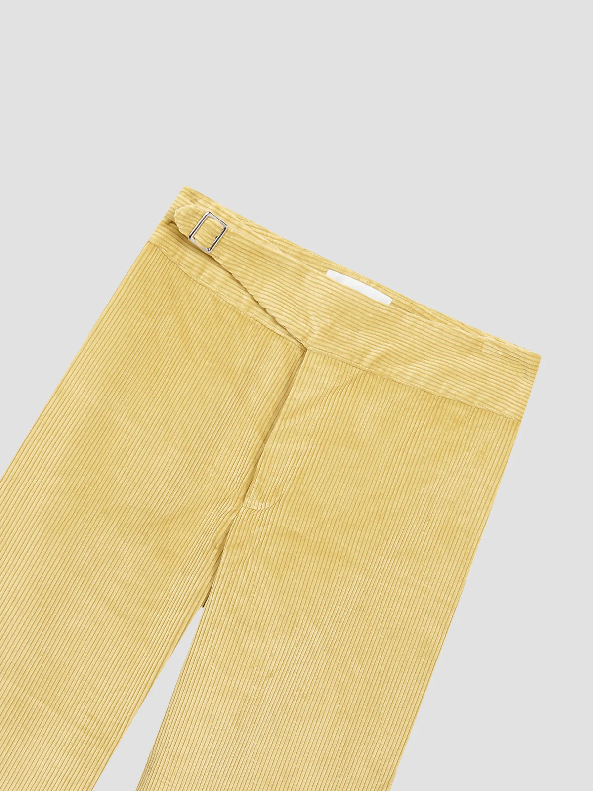 Light yellow corduroy pants with belt loops and front button fly closure.