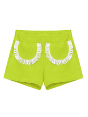 Lime green fringed shorts with white U-shaped trim panels