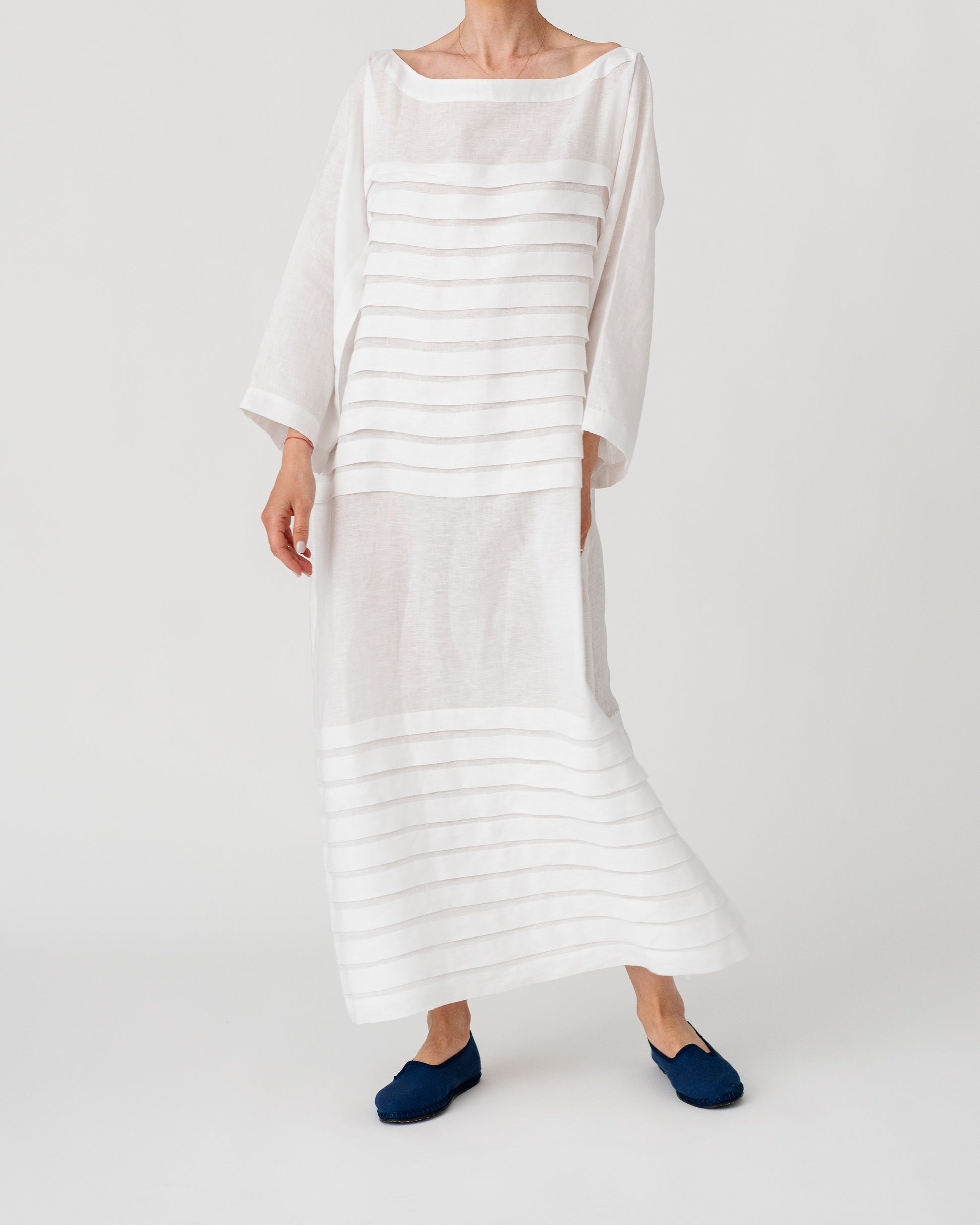 Light white maxi dress with horizontal stripe bands and three-quarter dolman sleeves