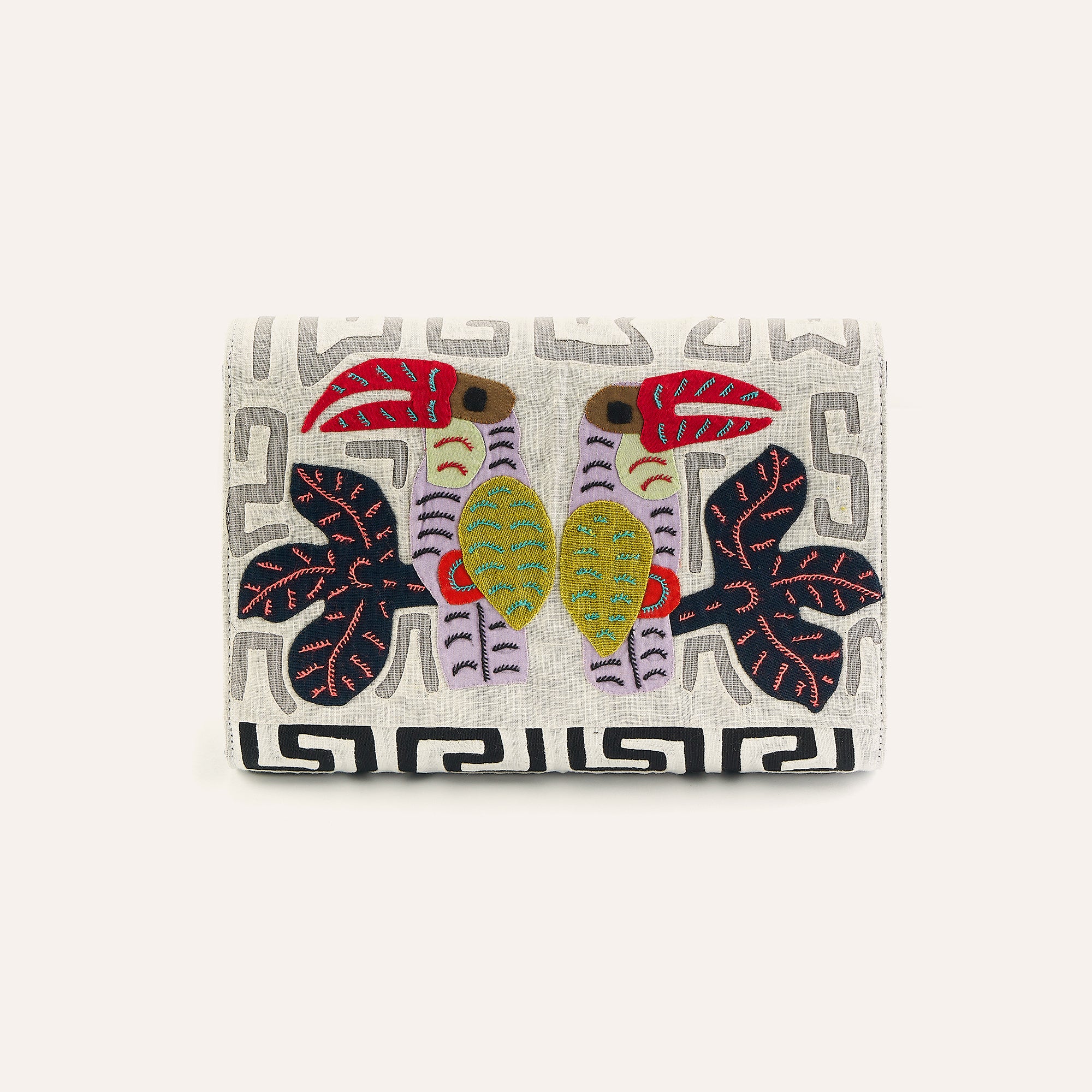 Cream fabric clutch with colorful elephant embroidery and Greek key border