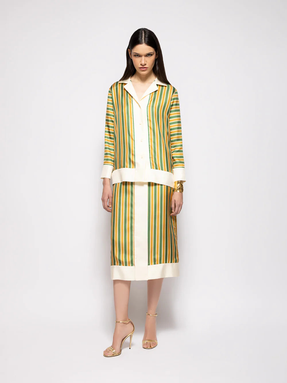 Striped silk twill skirt with vertical gold, green, and white stripes and white hem band