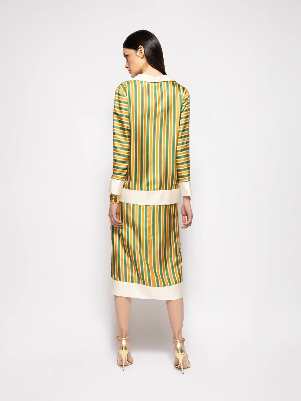 Back view striped silk twill skirt with vertical gold, green, and white stripes