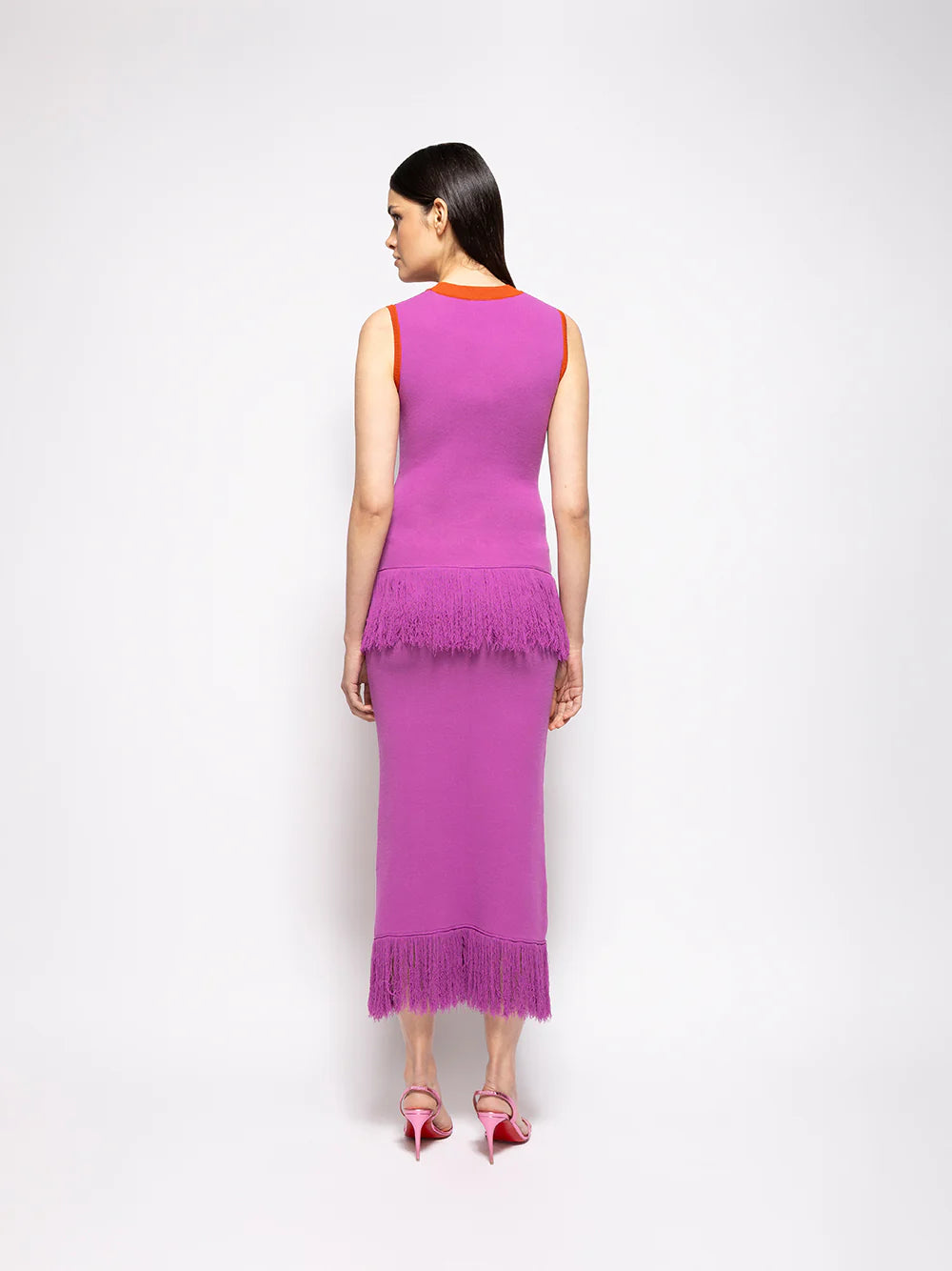 Purple midi skirt with orange waistband and fringe hem; allover jacquard print
