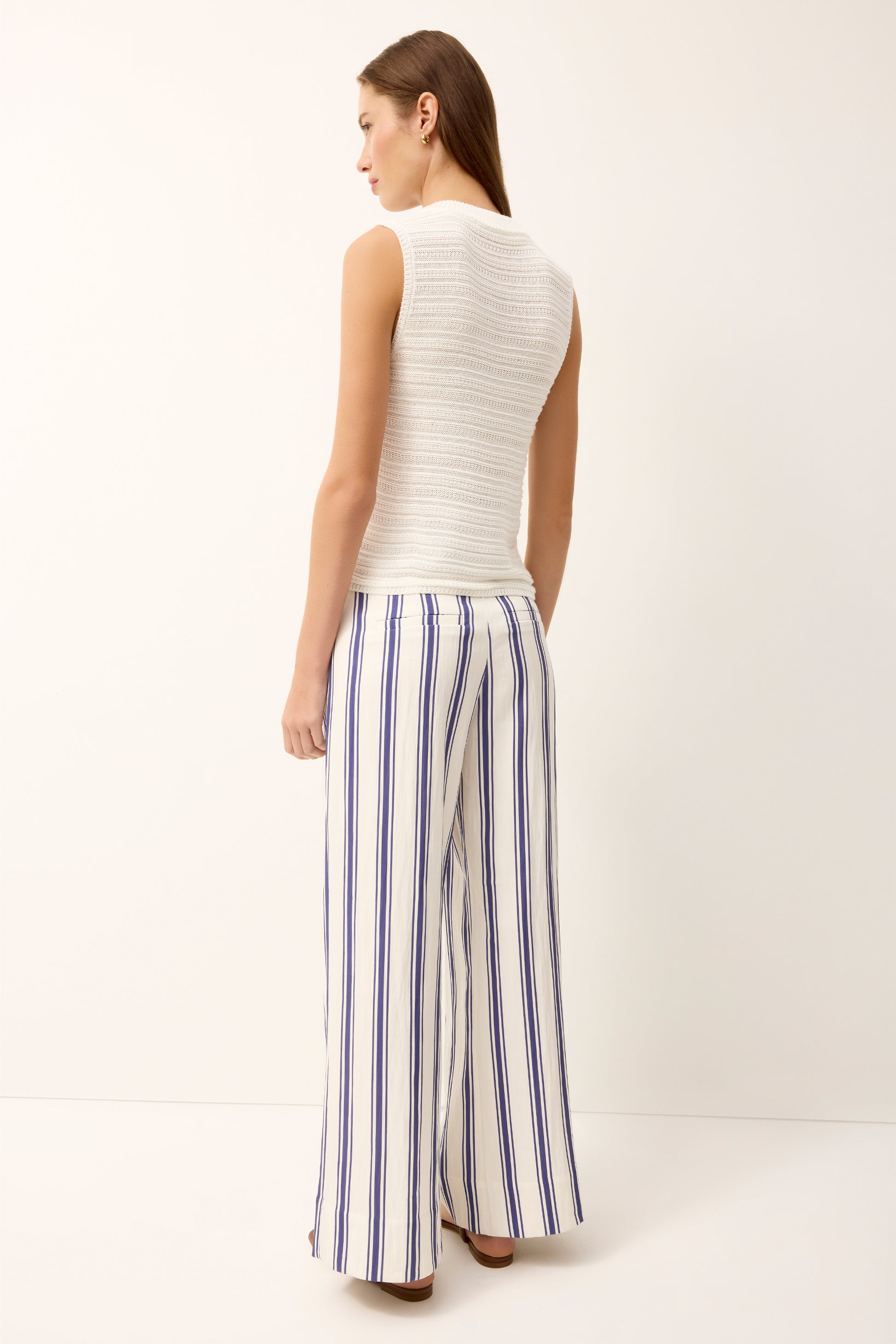 Wide-leg striped pants with vertical navy-and-white pattern, high waist
